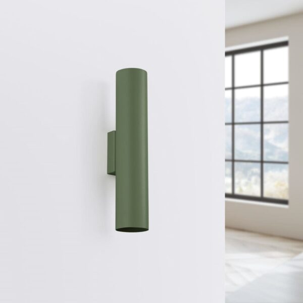 Slim green cylindrical wall light mounted on a white wall
