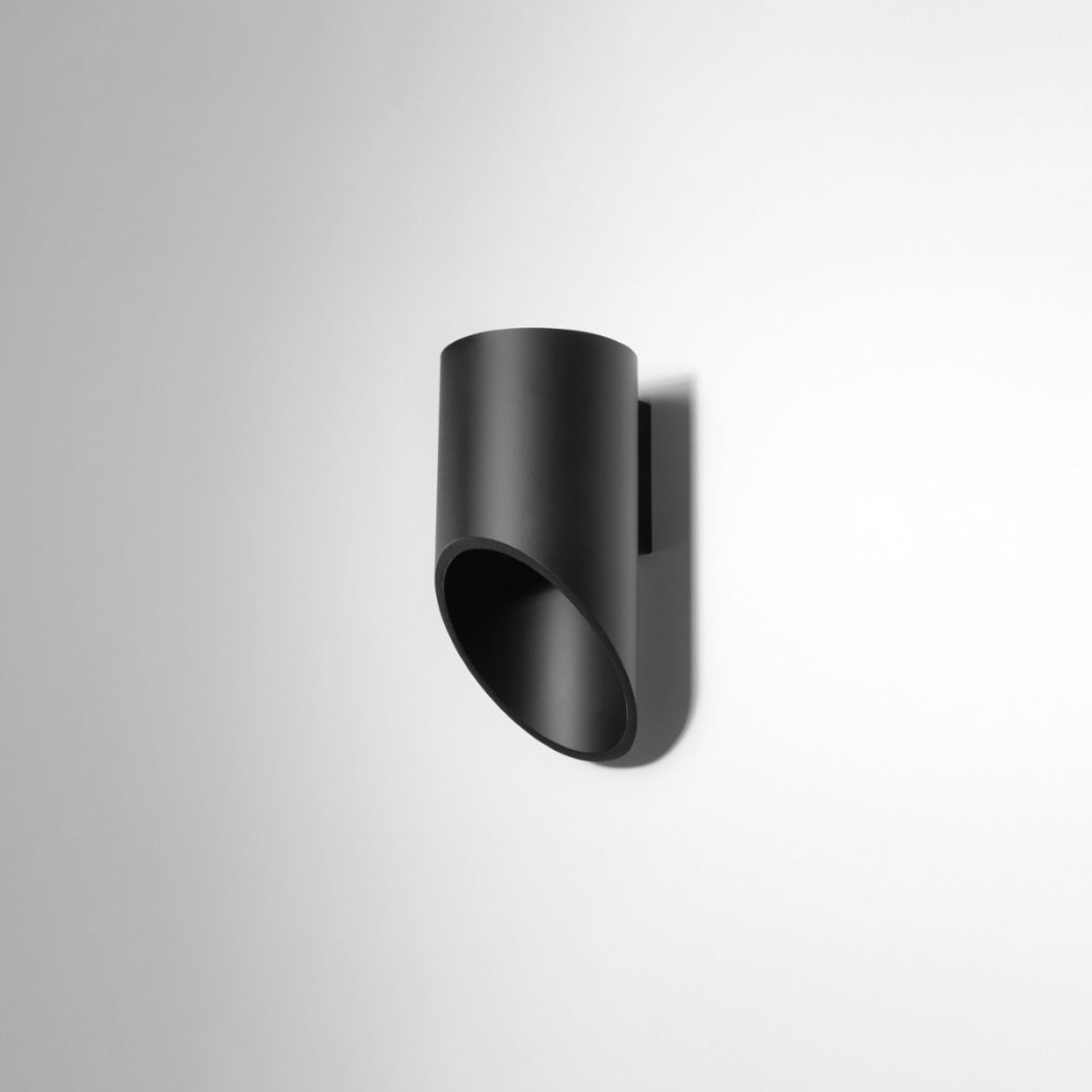 Black cylindrical wall light with an angled diagonal cut opening