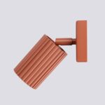 Terracotta ribbed spotlight wall light with square base seen from the side