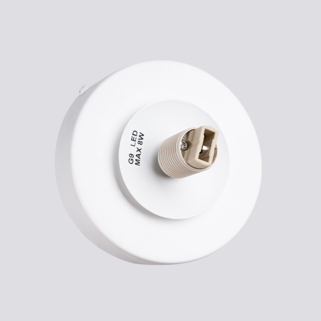 Close-up of the round wall light back plate with a G9 LED bulb holder