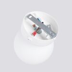 Open interior view of the round glass ball wall light showing its switch and wiring