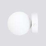 Side view of the white round glass ball wall light with its toggle switch
