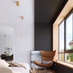 Bedroom with wood cube ceiling lights above the bed near a black wall and a window