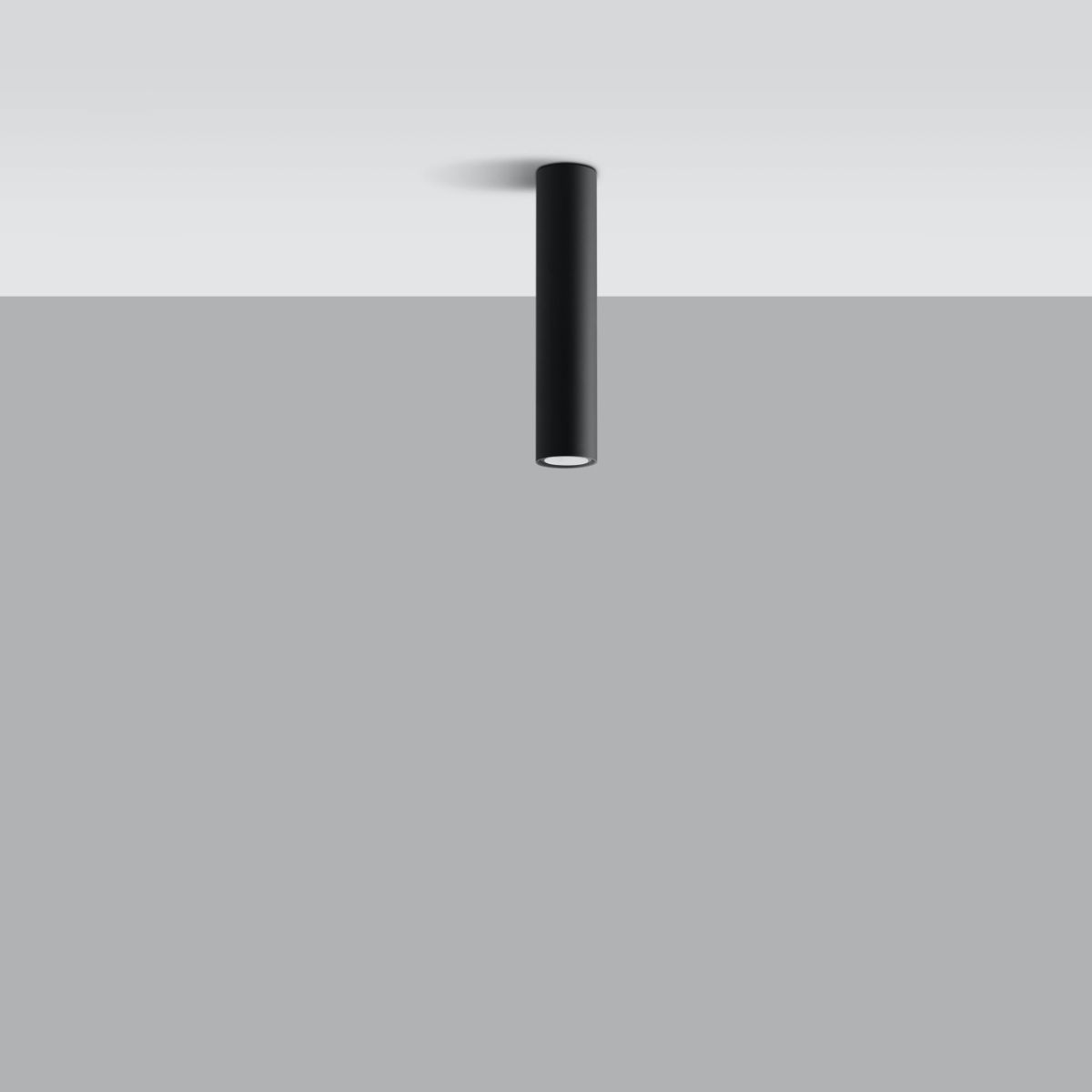 Black cylindrical spotlight mounted flush against the ceiling