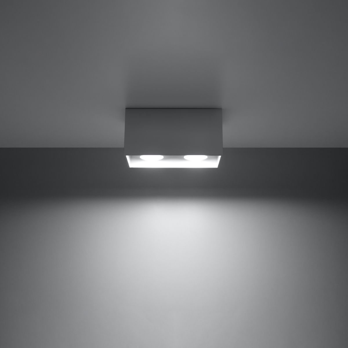 White rectangular ceiling light glowing softly with two lit apertures visible