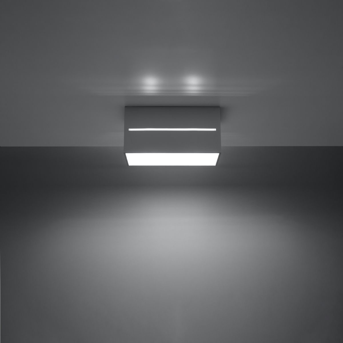 Rectangular aluminium ceiling light with striped top glowing downward