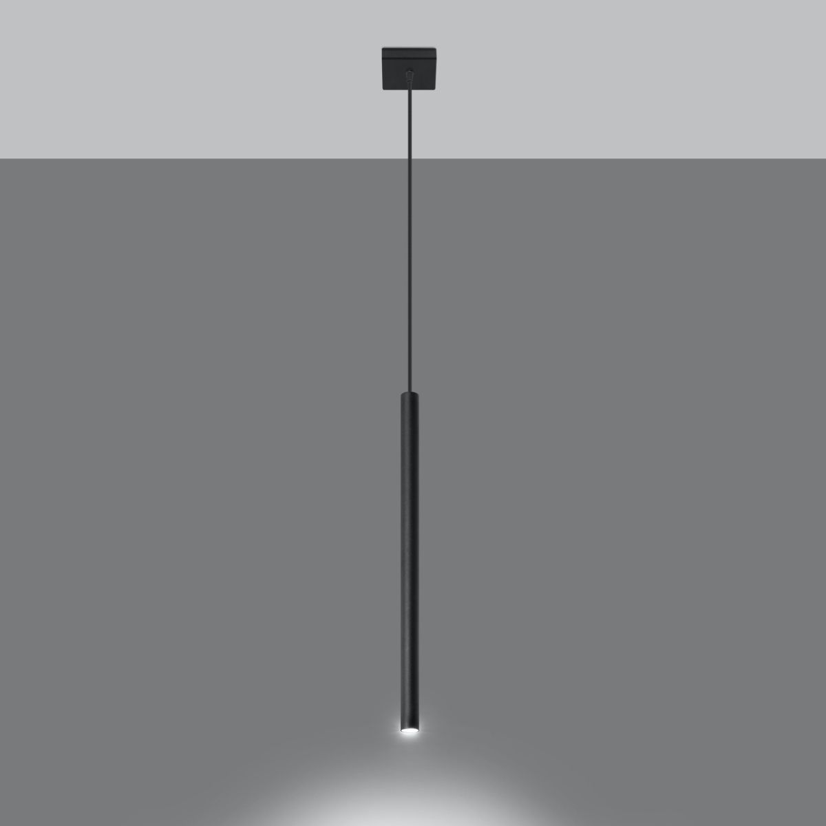 Slim black cylindrical pendant light with its tip glowing against a grey background