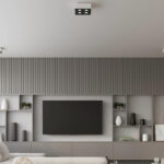 Small black square four light ceiling fixture above a wood slat TV wall
