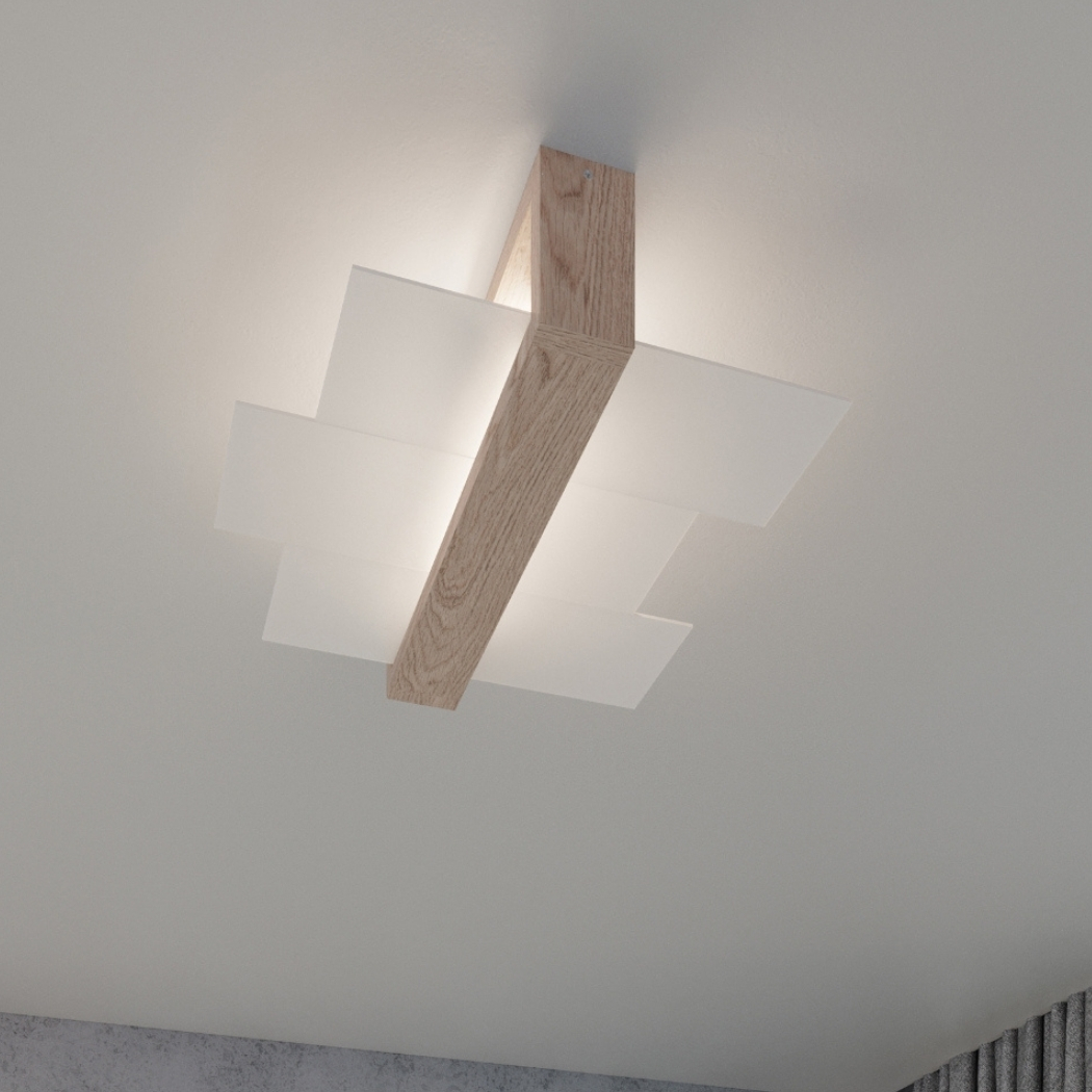 Close-up of the crossed wood beam and white glass panels of the ceiling light against the ceiling