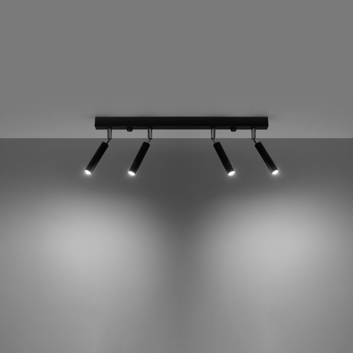 Four spot black LED ceiling light bar angled downward