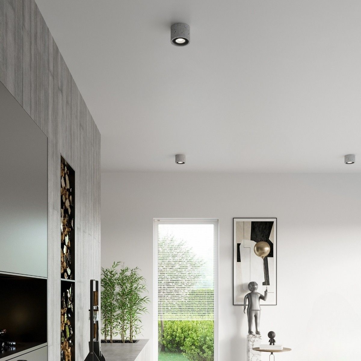 Concrete look ceiling spotlights above a stone clad living room wall