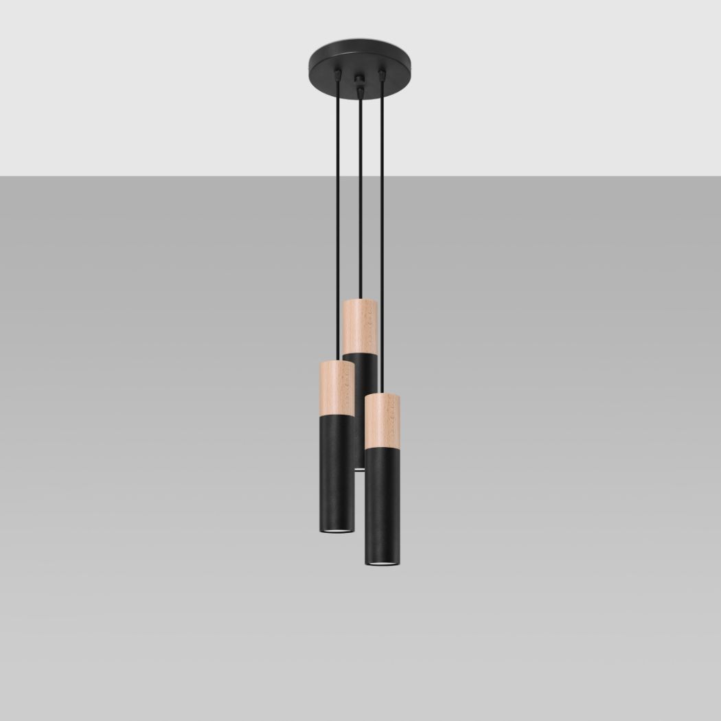 Three black and wood cylindrical pendant lights at staggered heights