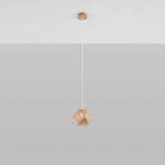 Small faceted wood pendant light hanging from a long white cord