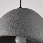 Close-up of the textured grey surface at the top of the dome pendant lamp