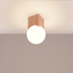 Wooden cube ceiling light with an opal glass sphere shade below, switched off
