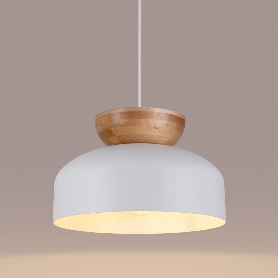 Close-up of the white dome pendant light showing the wooden ring and bulb