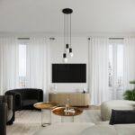 Living room with a black three-pendant cluster above a wooden sideboard and TV