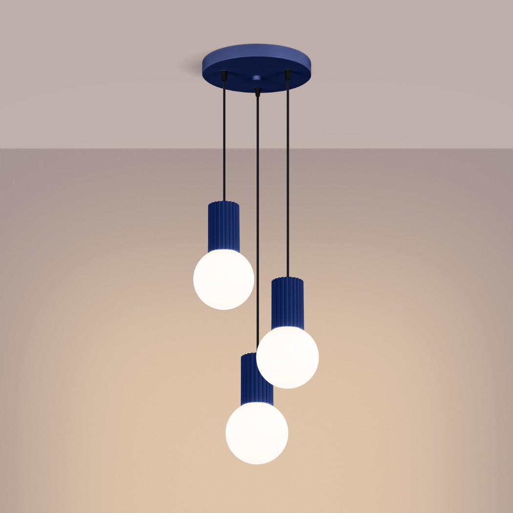 Three navy blue ribbed pendants with round glass globes hanging at staggered heights