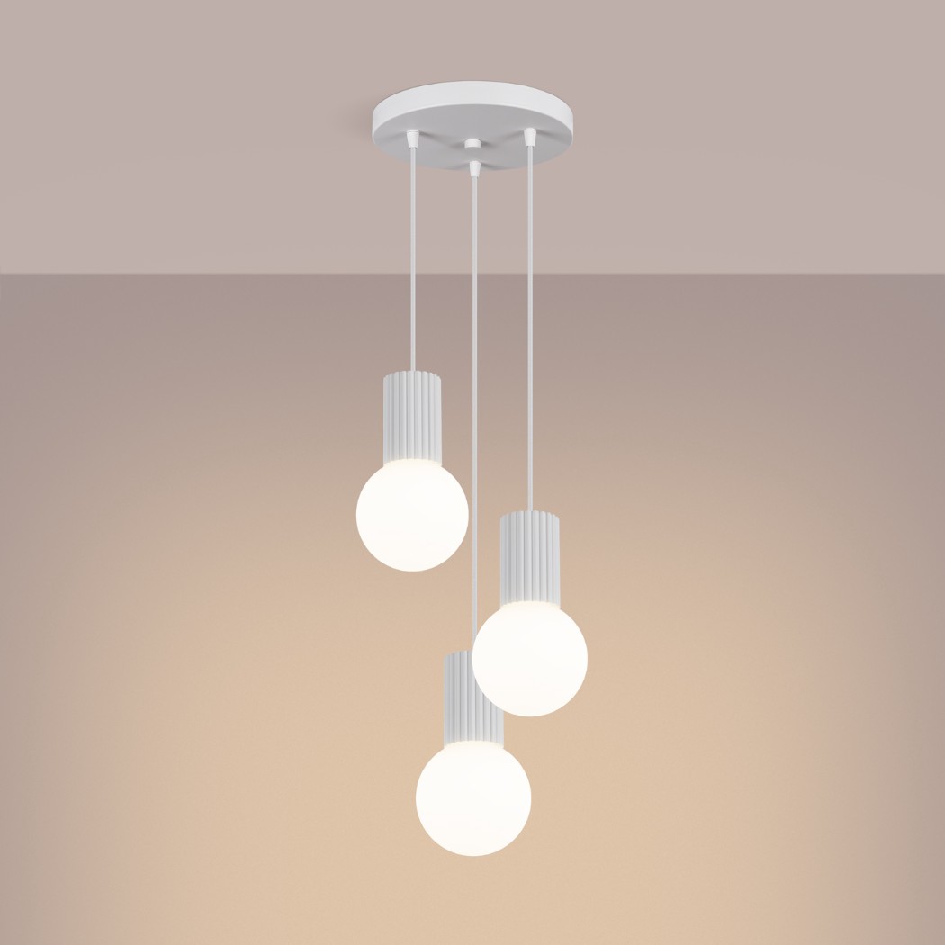 Three white ribbed pendants with round glass globes hanging at staggered heights