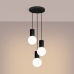 Three black ribbed pendants with round glass globes hanging at staggered heights