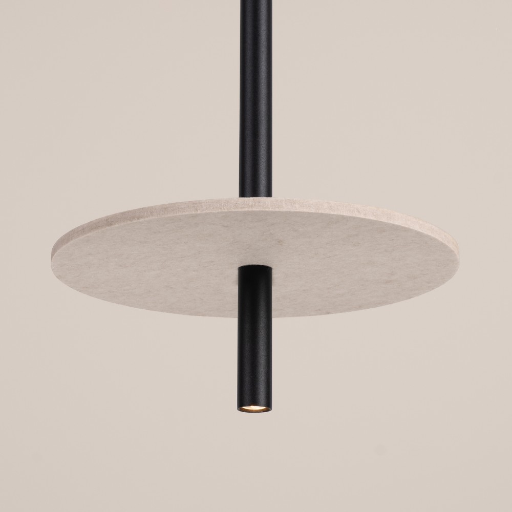 Minimalist pendant light with a black rod and beige felt disc shade