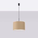 Beige fabric drum pendant light suspended from a slim black rod