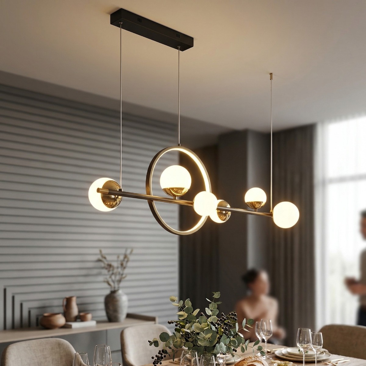 Linear pendant light with six gold rings and opal glass globes above a dining table