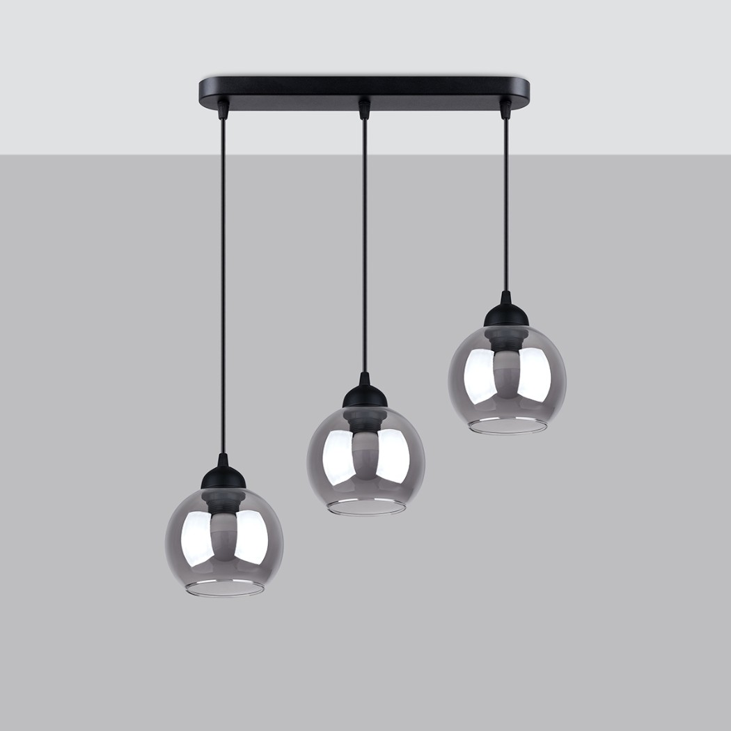 Three smoked glass globe pendant lights on a black ceiling bar