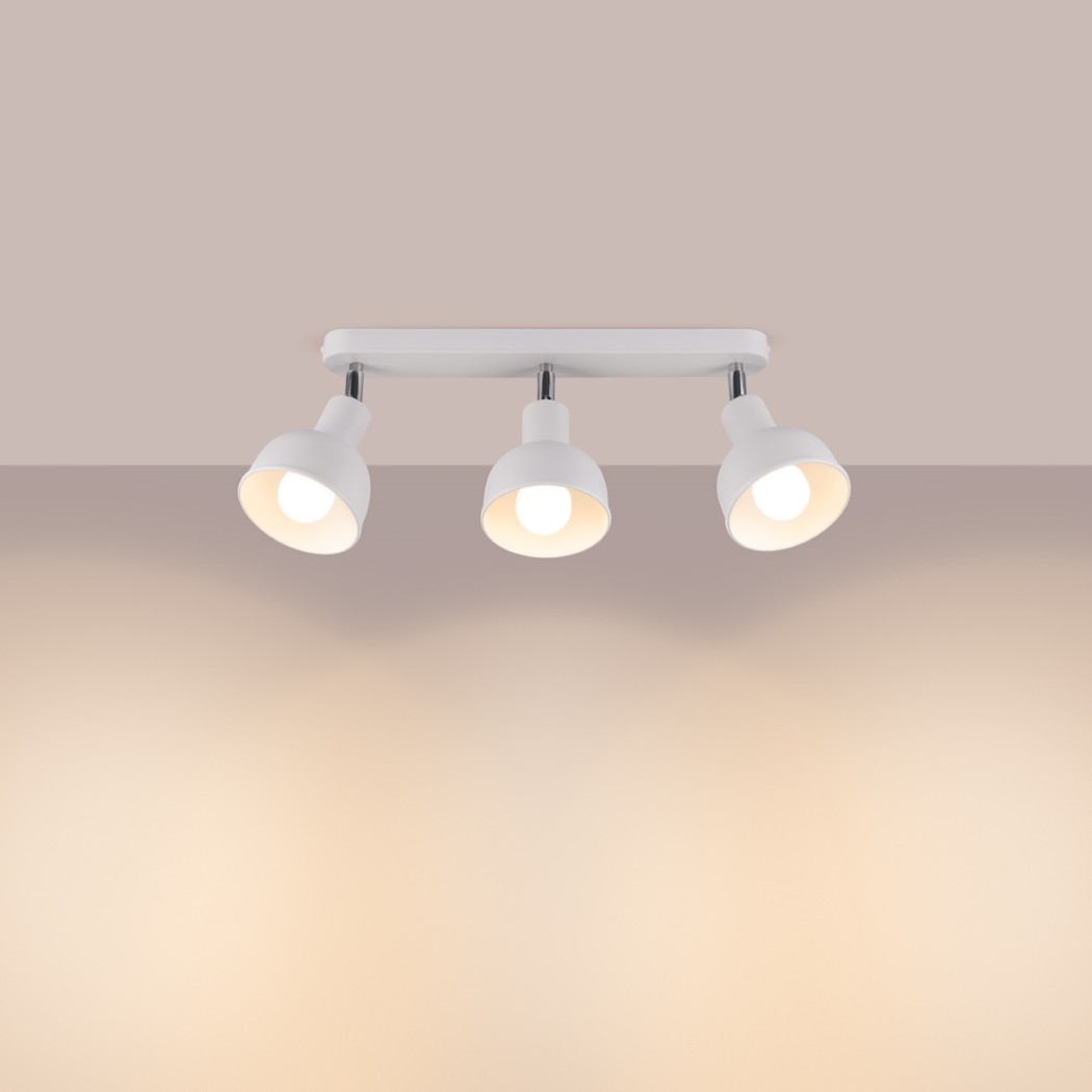 White ceiling light with three adjustable heads and a warm glow