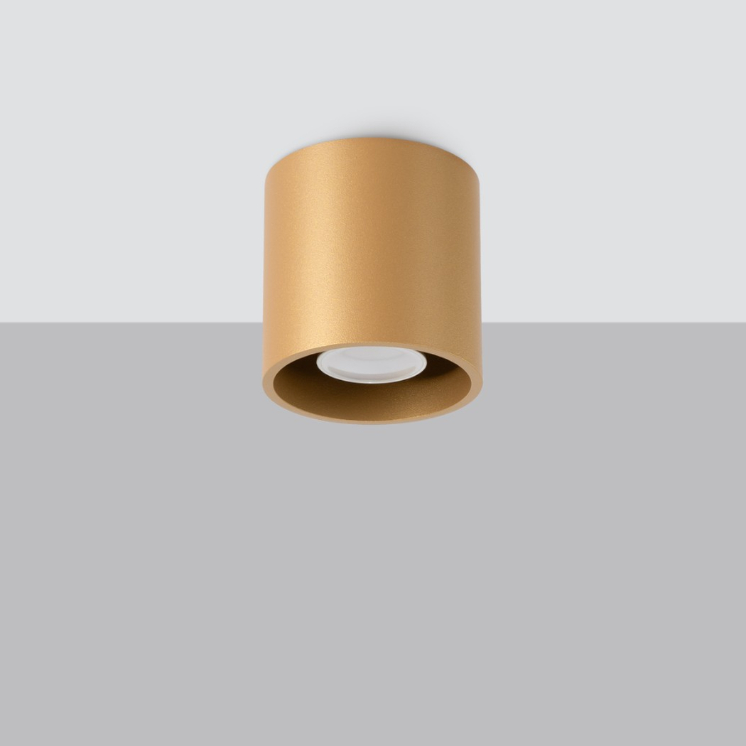 Gold cylindrical ceiling spotlight with a recessed round lens