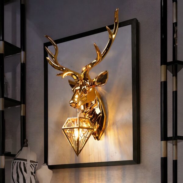 Gold deer head wall light with a diamond shaped cage lamp on its chest