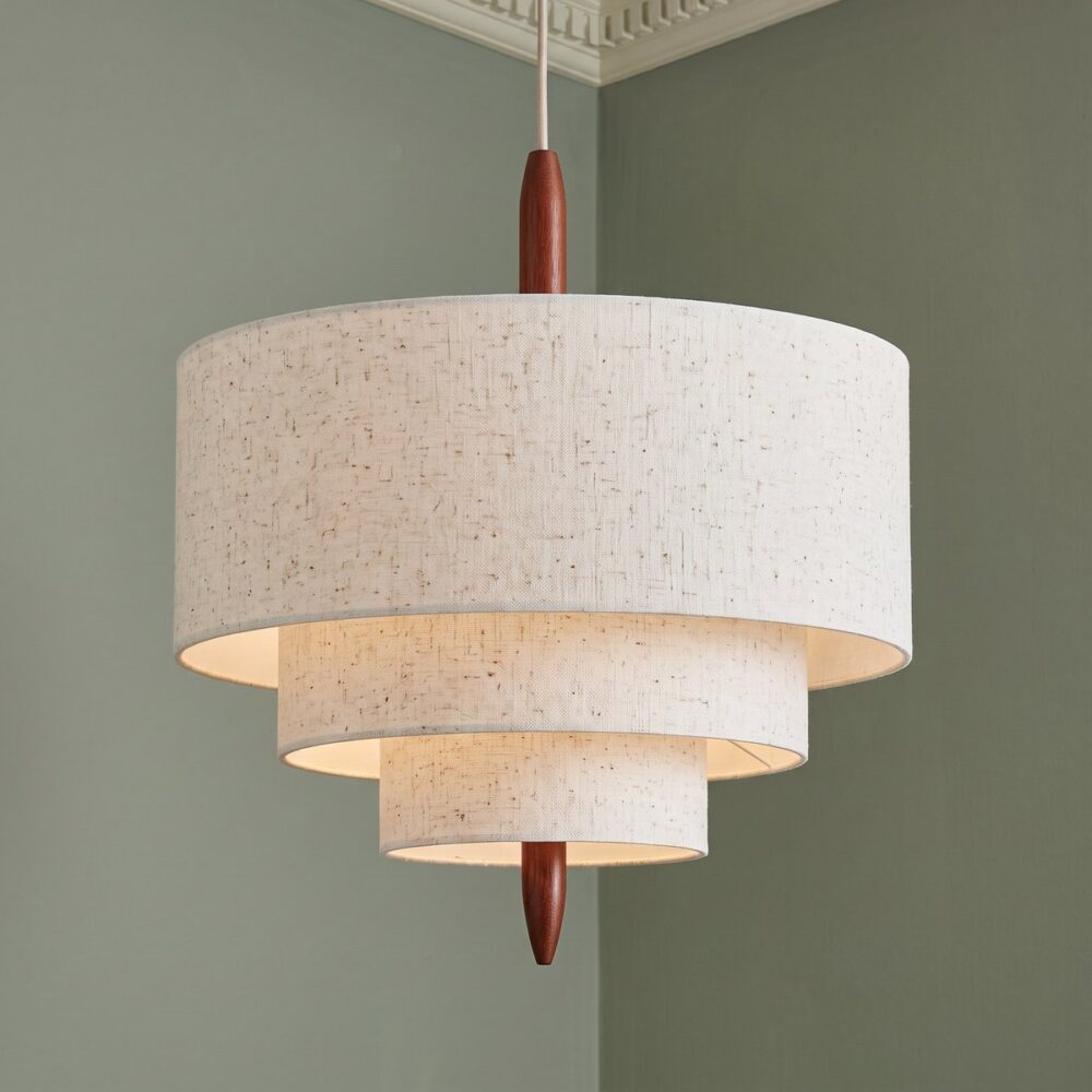 Contemporary Japanese Pendant Light in Beige Fabric Japanese pendant light in beige fabric with three round shades against a green wall