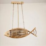 Fish-shaped woven bamboo pendant light suspended on chains