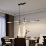 Black linear LED pendant with two spotlights above a dining table