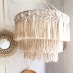 Macrame pendant light with a layered cream fringe and tassel shade