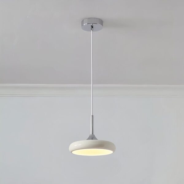 White disc pendant light on a slim chrome rod