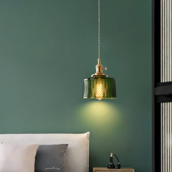 Green ribbed glass drum pendant light on a brass fitting