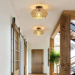 Hallway with two woven rattan flush ceiling lights above sliding barn doors