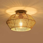 Woven rattan drum ceiling light glowing warmly from within