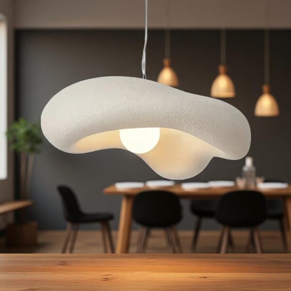 Organic curved white resin pendant light with a round glass globe