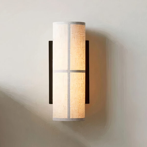 White fabric cylinder wall light with a black cross bar frame