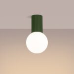 Green fluted ceiling light with a round white glass globe
