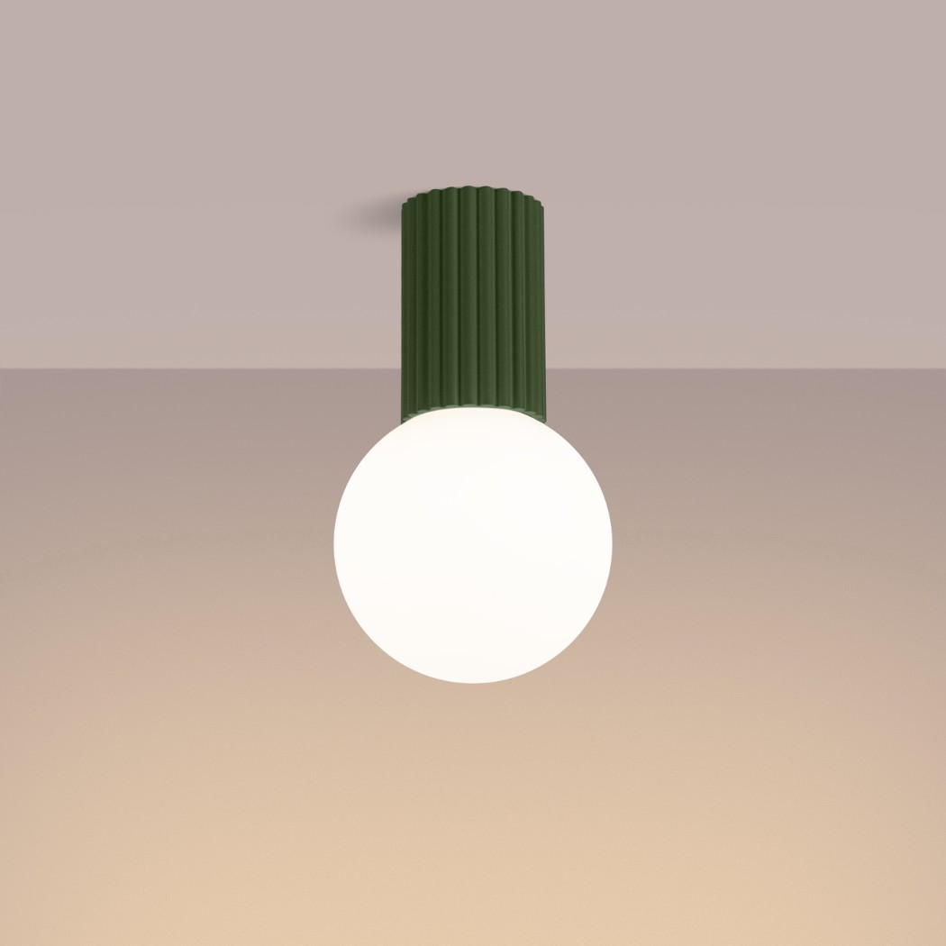 Green fluted ceiling light with a round white glass globe