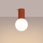 Terracotta fluted ceiling light with a round white glass globe