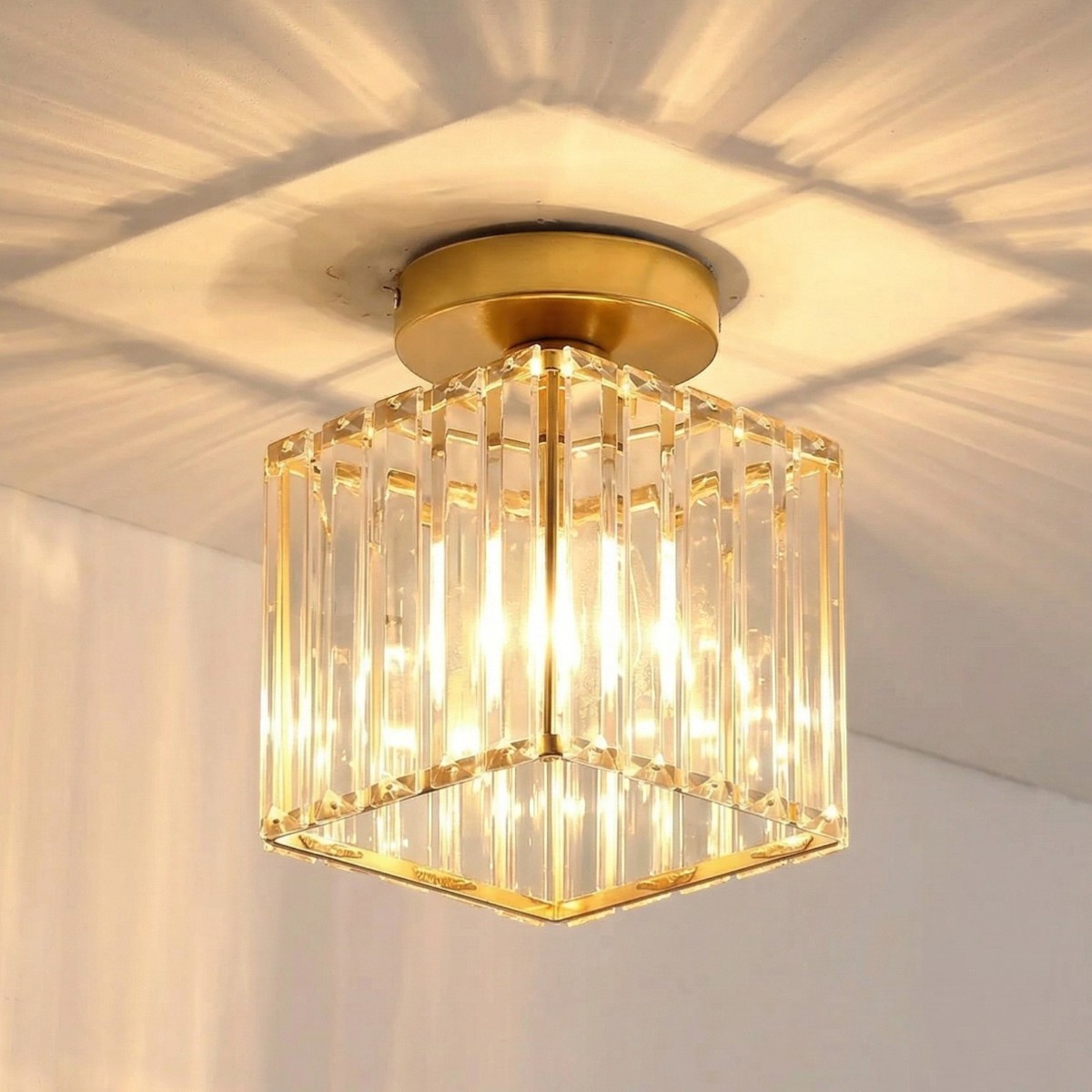 Gold square ceiling light with faceted crystal glass rods and warm glow