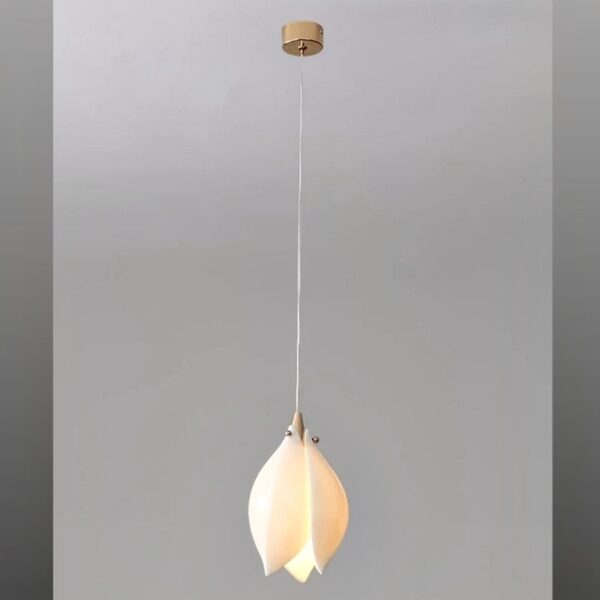 White magnolia-shaped ceramic pendant light on a long hanging cord