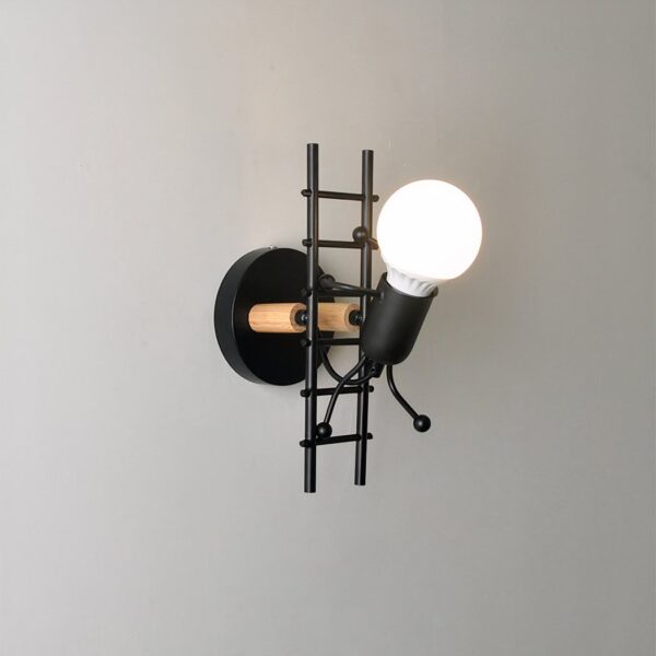 Black wire wall light shaped like a figure climbing a ladder with a bulb