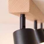 Wood bar and black metal ceiling light with adjustable spots